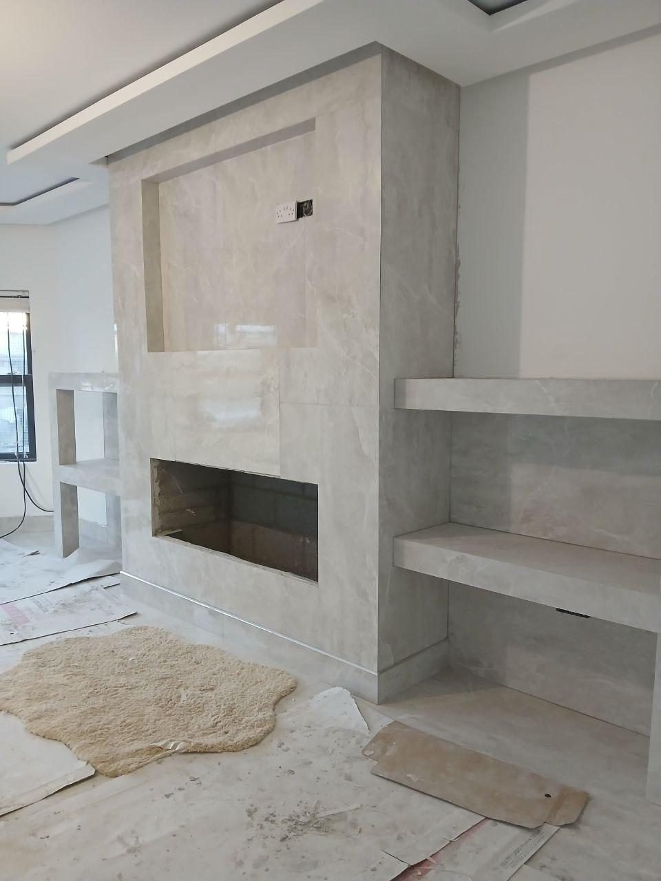 Marble-effect feature wall and fireplace tiling in Cork
